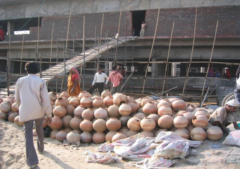 Locally sourced “matkas” used to insulate the roof to counter heat absorption.