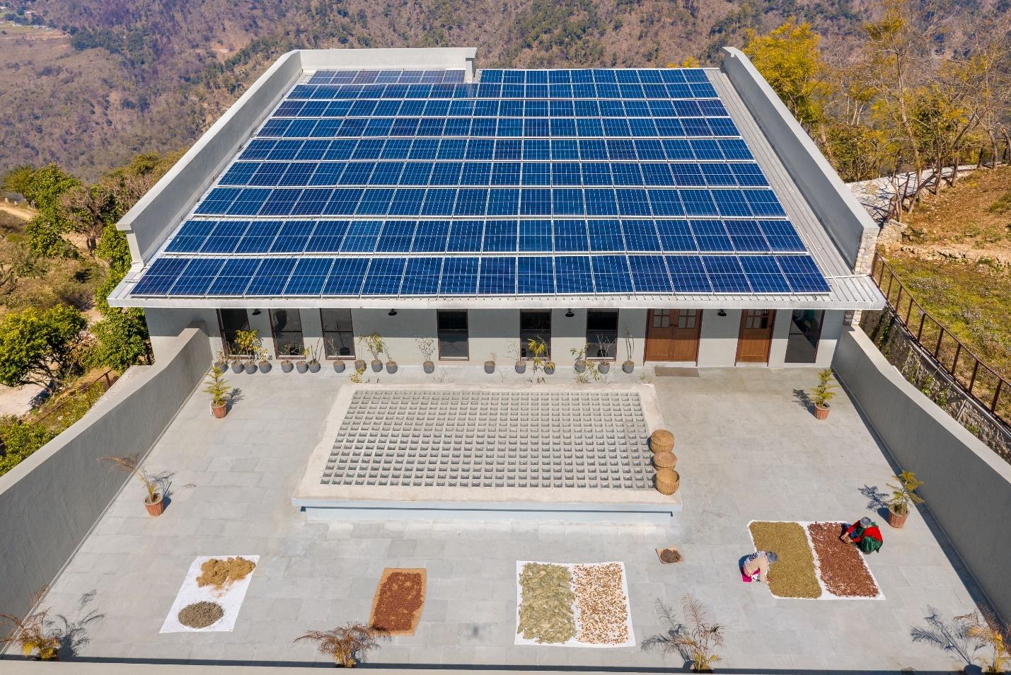 Solar panels installed on the roof of the Lodsi Community Project for Forest Essentials—a net-zero energy and water facility designed by Morphogenesis.