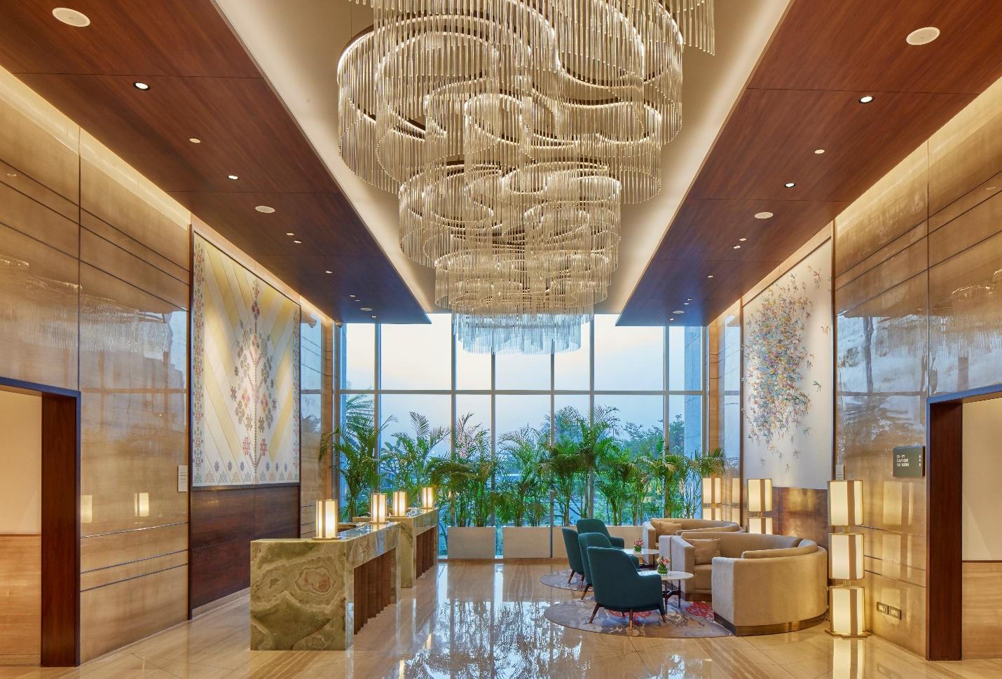 Taj BIAL’s reception area with Serpeggiante marble tiles on the wall.